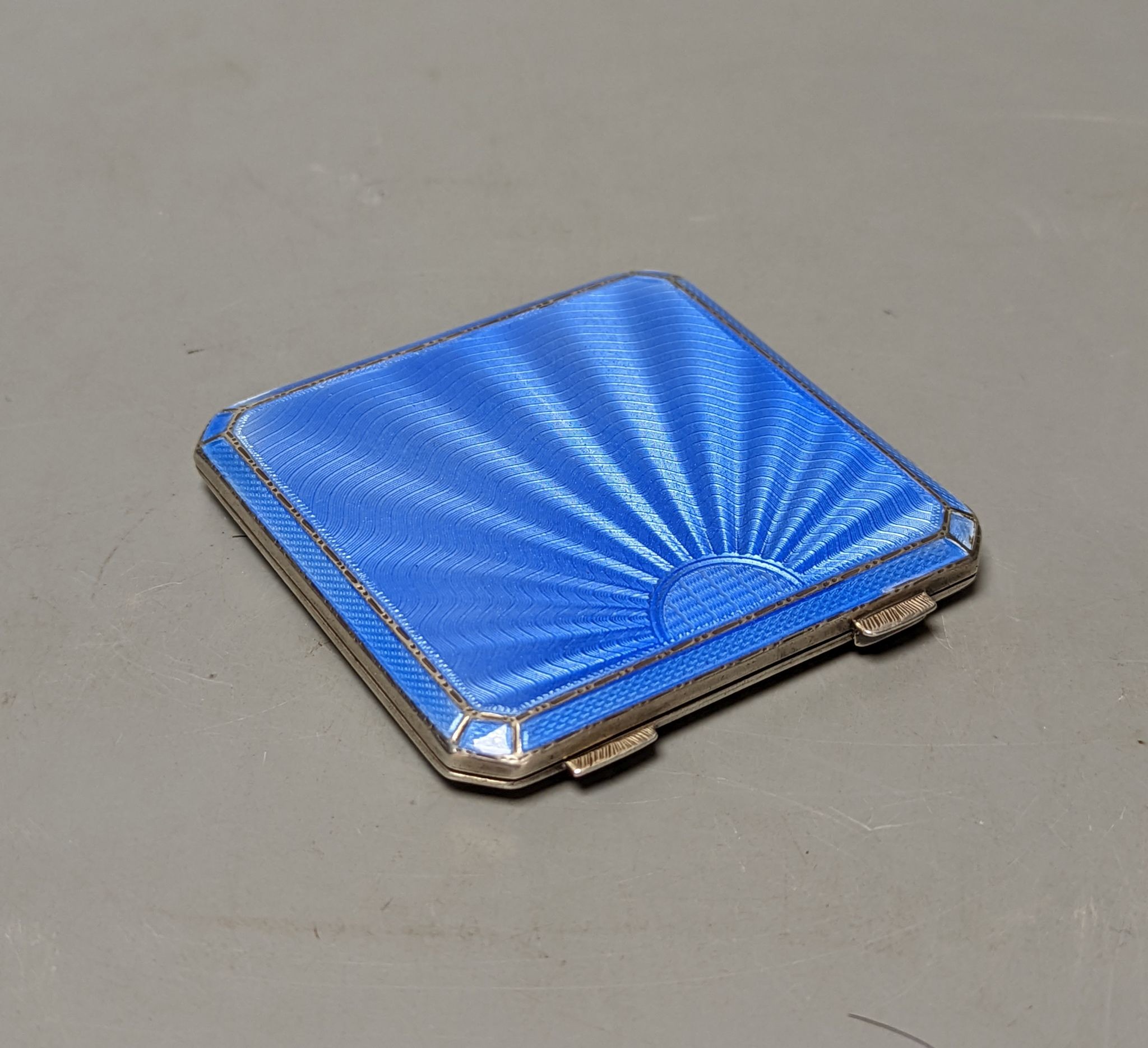 A 1930's At Deco Asprey & Co silver and blue guilloche enamel compact, 74mm.